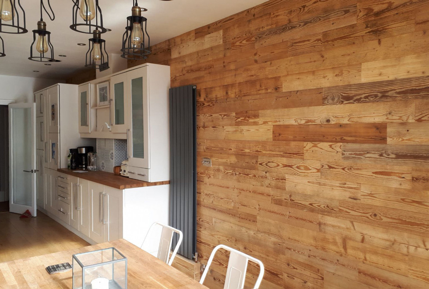 Can wood wall panels be used in bathrooms or kitchens?