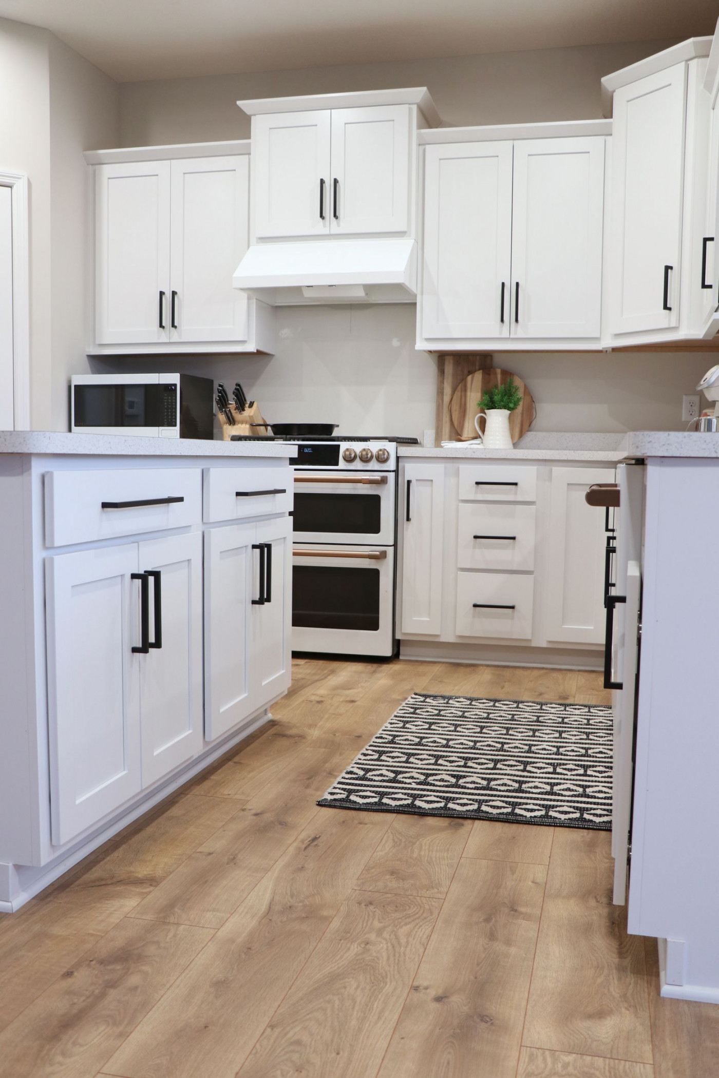 Modern Farmhouse Kitchen, with white cabinets and black hardware