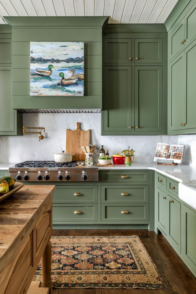 Traditional Farmhouse Kitchen With Green Cabinets and Artwork