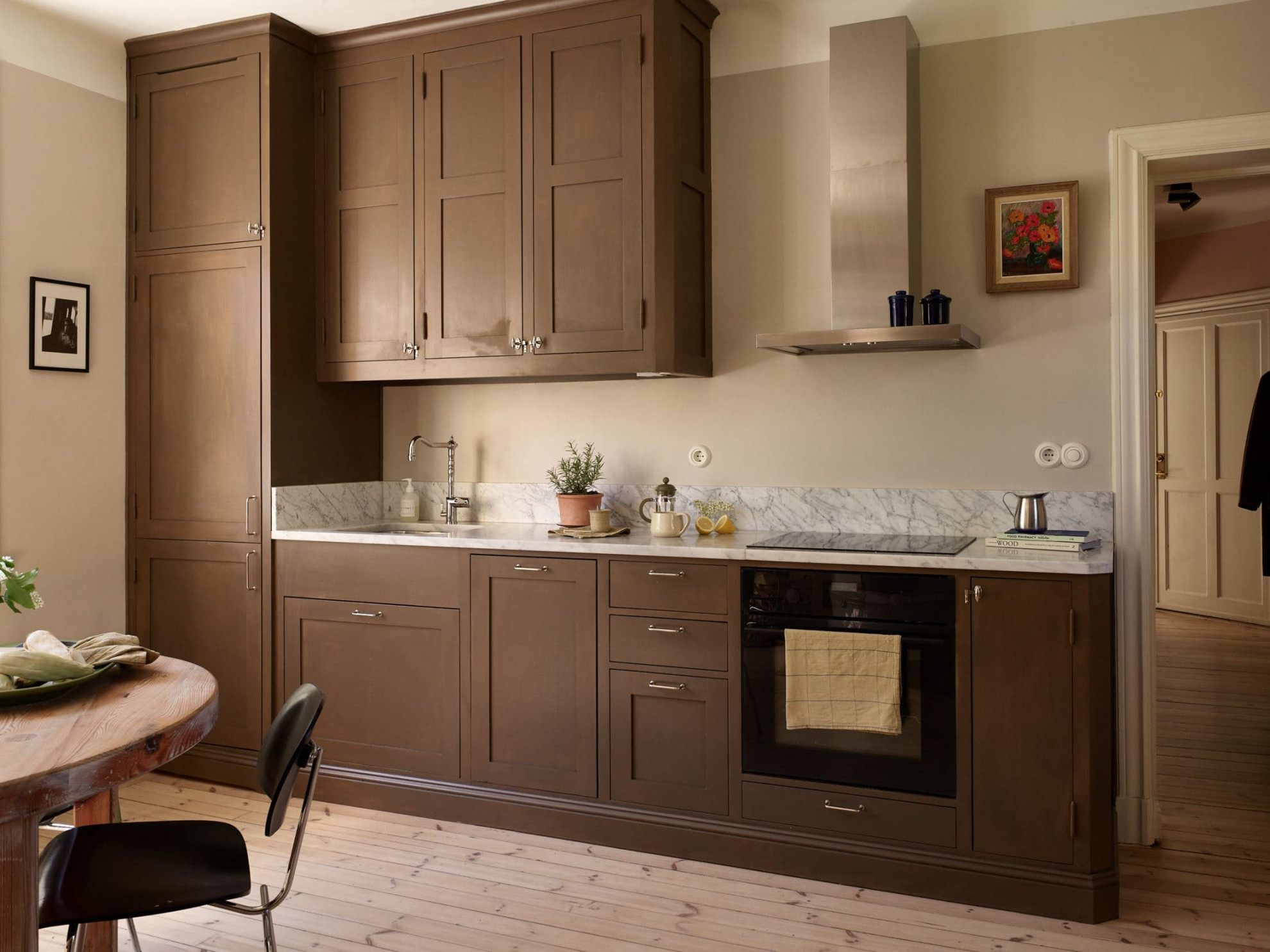 Brown kitchen cabinets in a spacious turn-of-the-century home