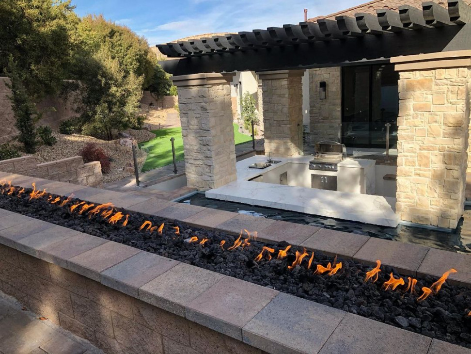 Custom Outdoor Oasis with Sunken Kitchen, Swim-Up Bar, and Moody