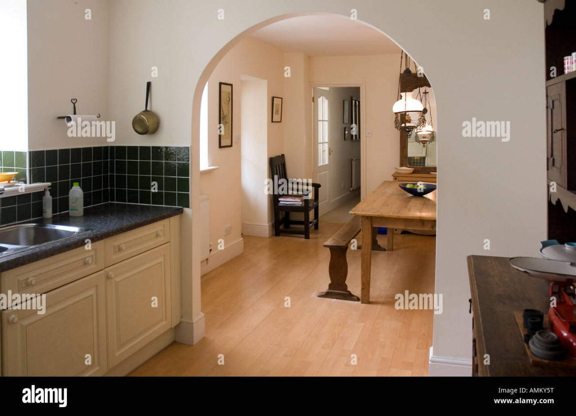 Kitchen with archway through to dining area Stock Photo - Alamy