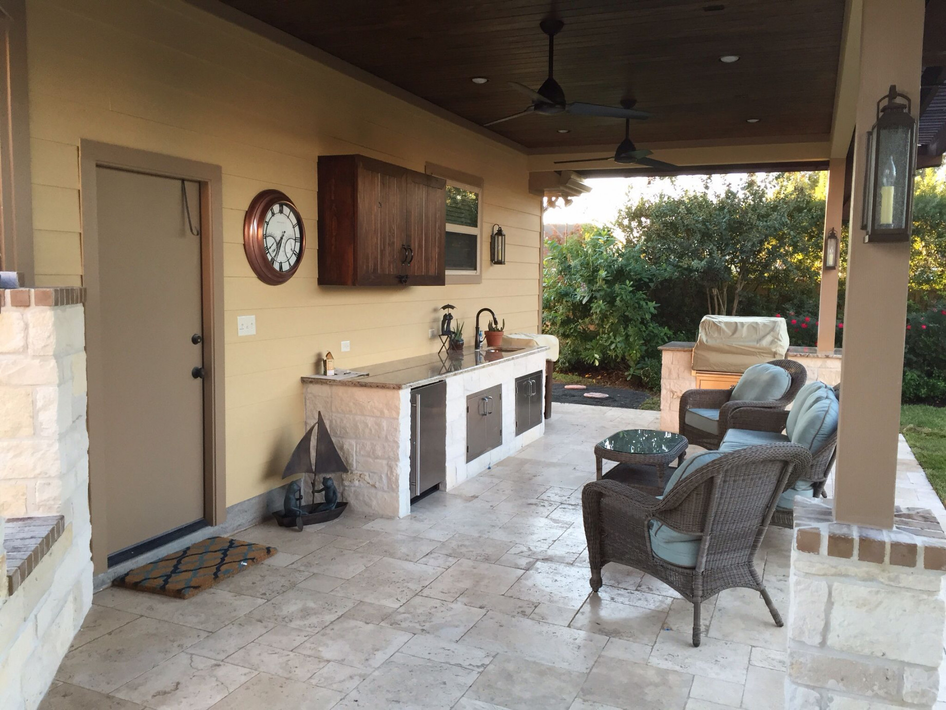 Outdoor kitchen built off garage and breezeway connecting to