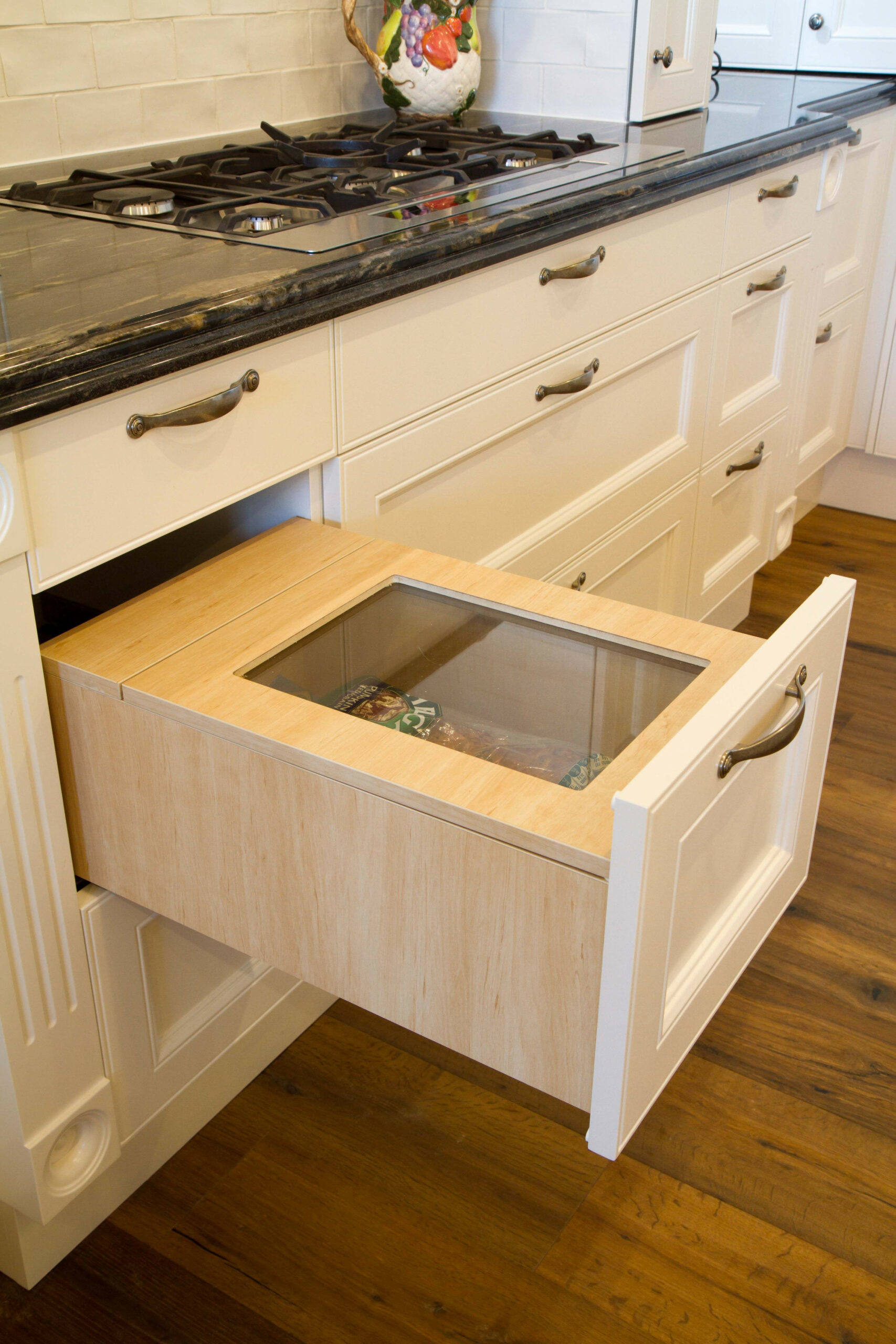 Custom, built in bread bin. www.thekitchendesigncentre.com